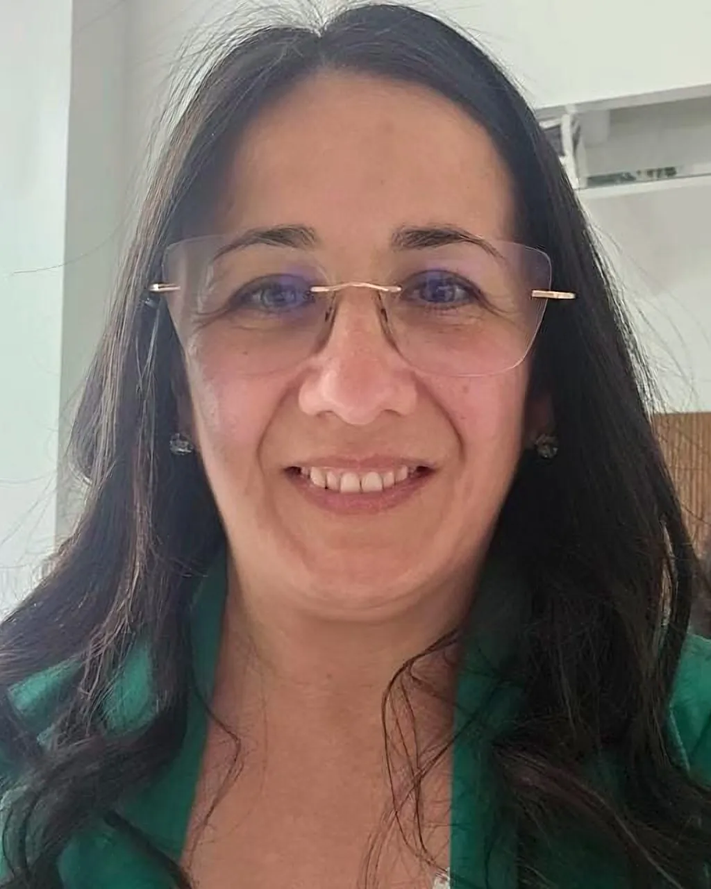 Dra. Claudia Garín, director of Estudio Jurídico Integral, smiling